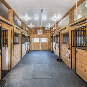 Inside Horse Barn with Trusscore and Horse Stalls