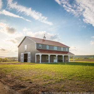 Big Barn at sunset ABM Panel Scarlet Red roof Charcoal sides