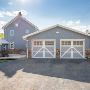 Garage with Vinyl Shake Siding and Metal Roof