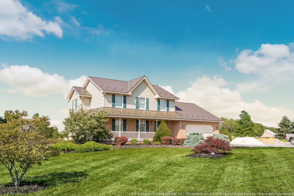 House with Bronze ABM Panel Metal Roof Instead of Shingles