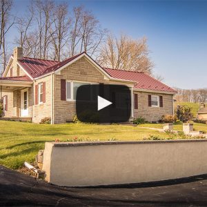 Building Showcase: Rancher with Textured Burgundy Metal Roof