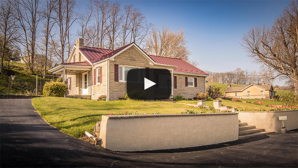 Building Showcase: Rancher with Textured Burgundy Metal Roof