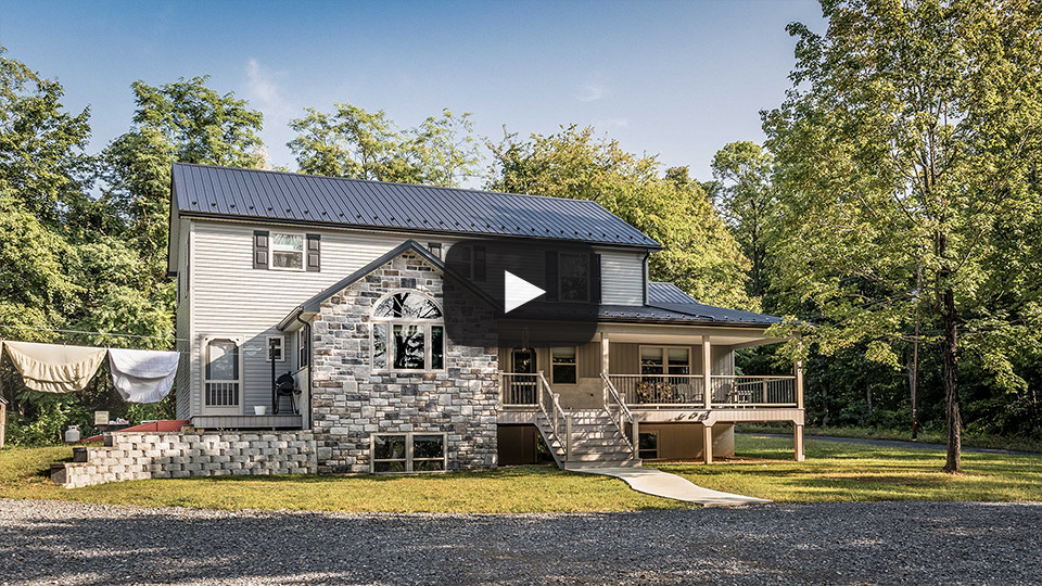 Building Showcase: Amish House with Textured Black Metal Roof