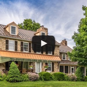 Perme House with Textured Bronze and Copper Penny Roof