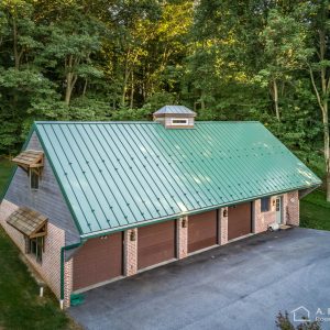 Classic Green ABSeam Panel Roof on Brick Garage